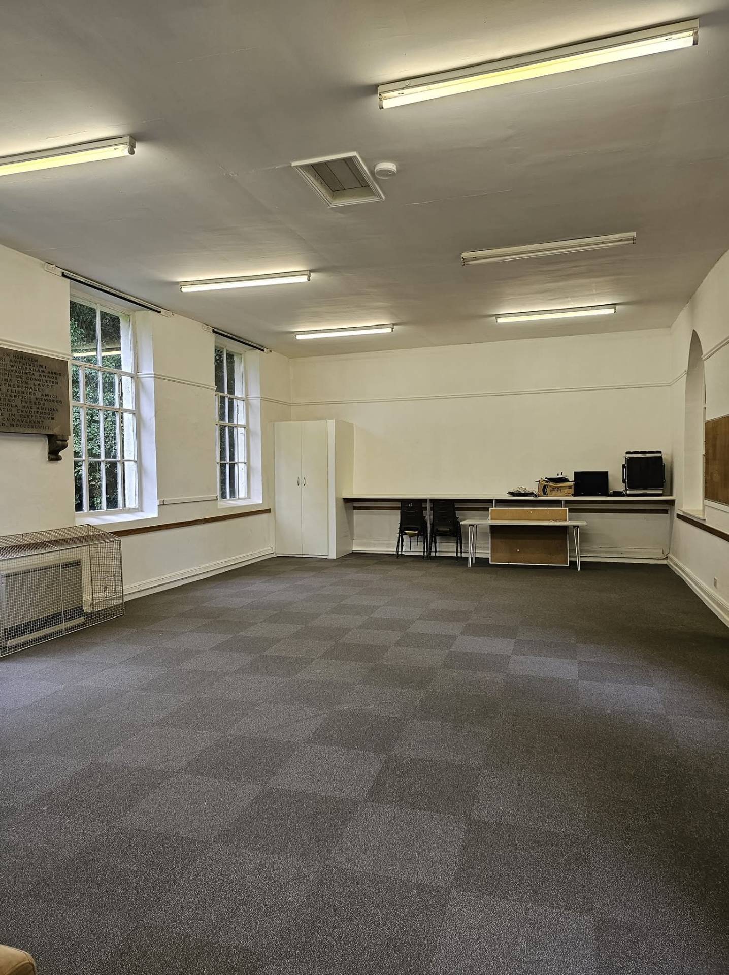 Same Congleton community hall repainted in soft white with an even ceiling
