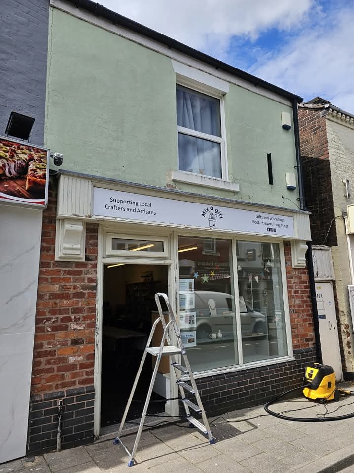 Cheshire shop front mid decoration with ladder in place and tired paintwork before repainting