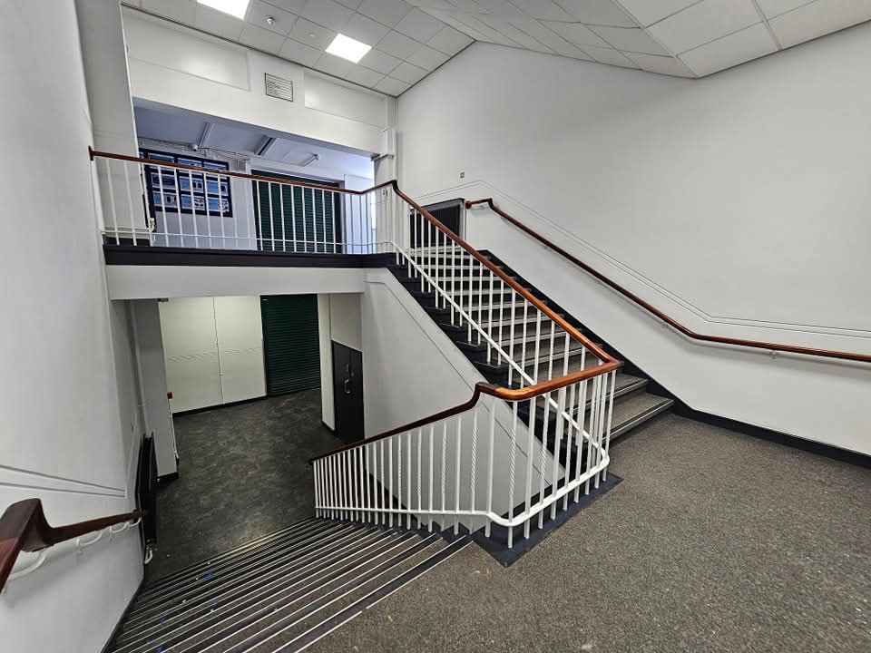 Commercial stairwell in Cheshire freshly painted in clean white